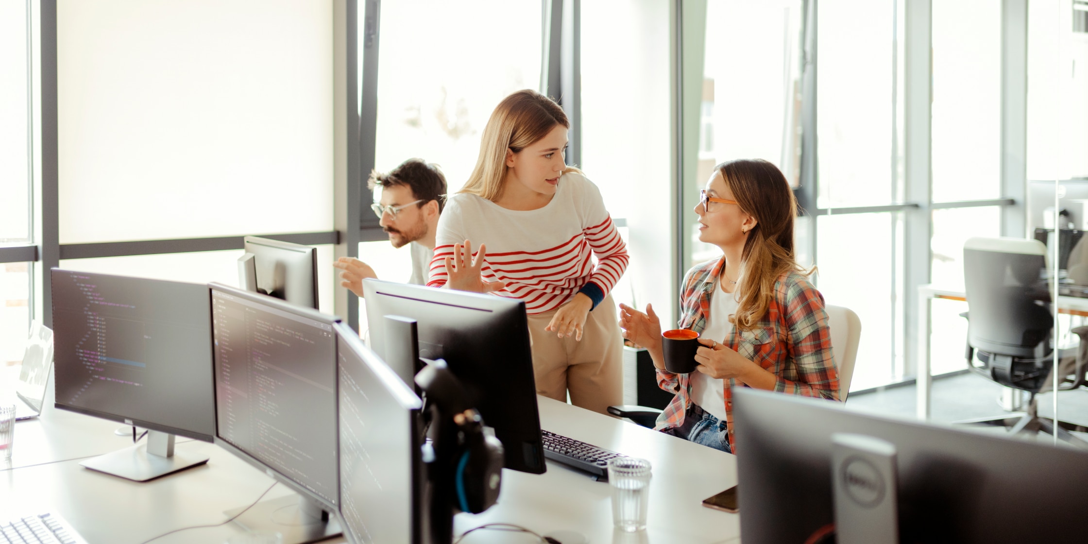 Two women having a discussion at a desk