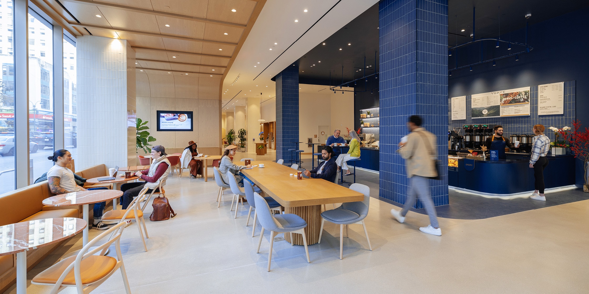 Community members relax, recharge and reconnect at their local Capital One Café.